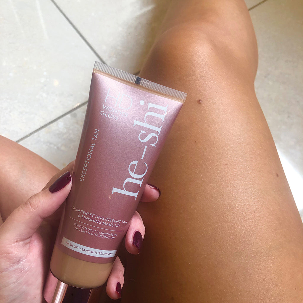 He-Shi HD Wonder Glow body makeup in a bottle, showcasing a rich, radiant glow for skin enhancement.
